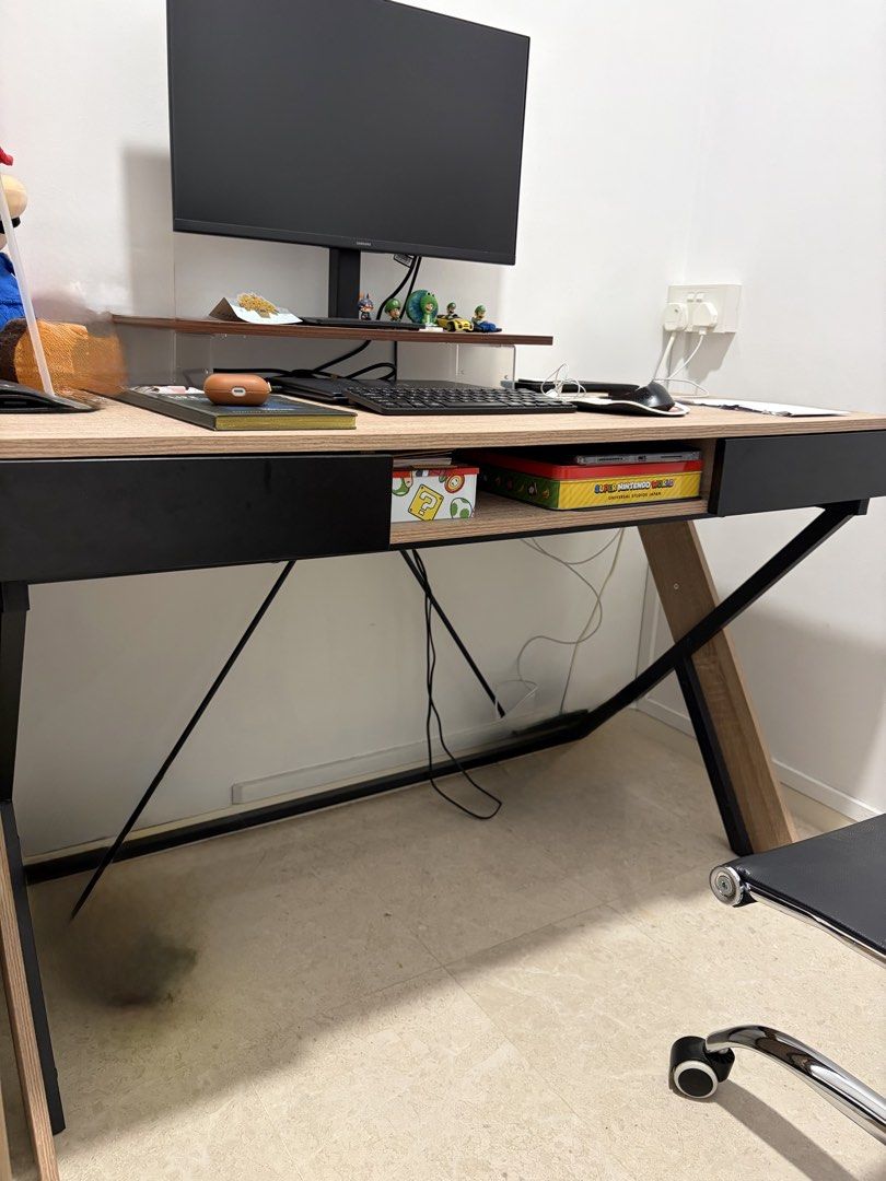 HipVan Study Table (Category: Tables & Sets) located in Singapore. Submitted by zw__l (Listing ID 1452072086, Image 1). Description: - Sturdy desk with a durable wooden top - Sleek black metal legs for stability - Convenient built-in drawer for storage - Generous surface area for monitor, keyboard, and more - Bought last year, still in very good condition. - 120 (W) by 60 (D).