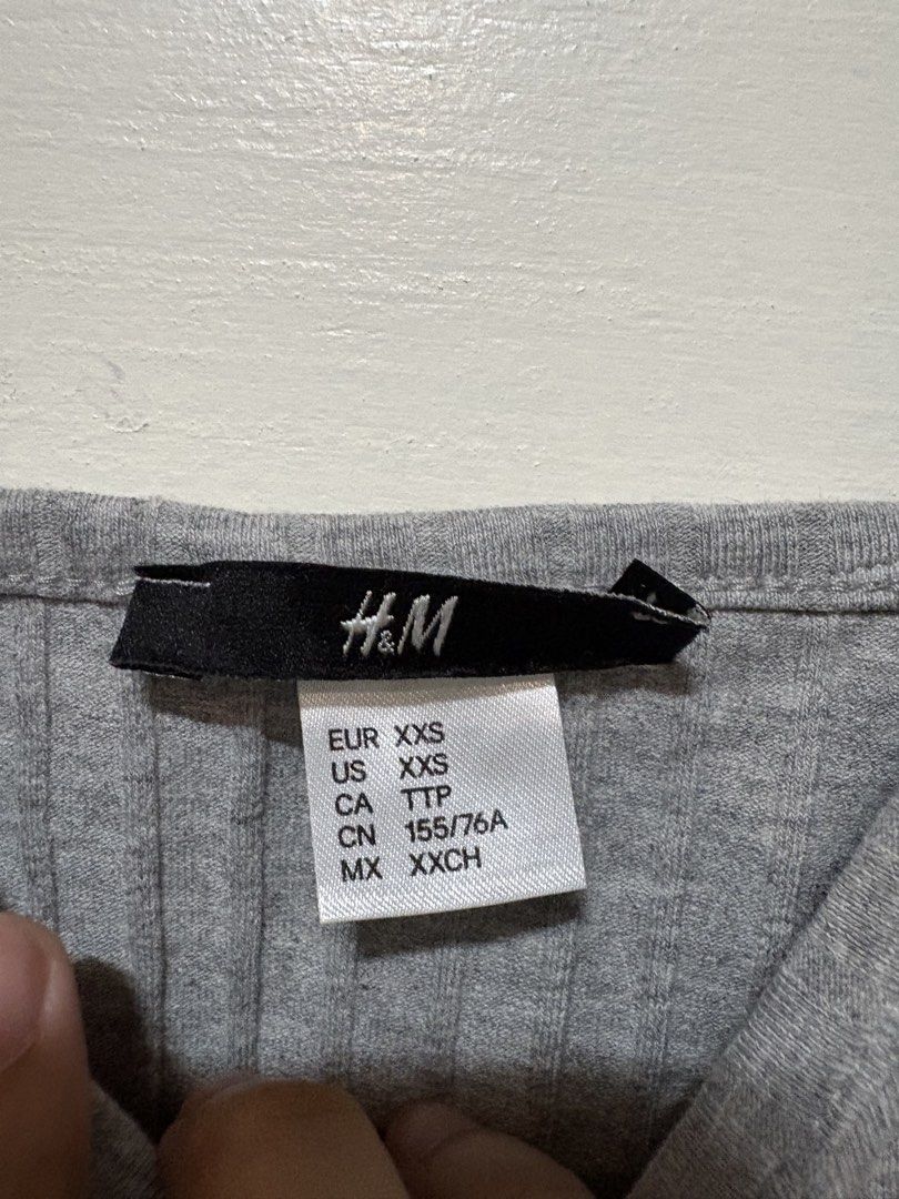 H&M Grey Ribbed Spaghetti Strap Crop Top (Category: Sleeveless) located in Taguig. Submitted by cftbncs (Listing ID 1452038863, Image 2). Description: - Grey ribbed crop top from H&M - Spaghetti straps and V-neckline - Super comfy and stretchy material - Ideal for layering or wearing solo - Easy to pair with jeans or shorts - Fits like an XXS.