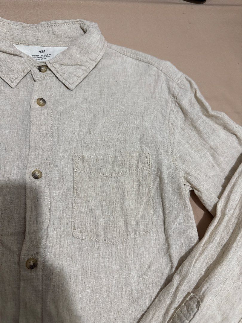 H&M Linen Blend Long Sleeve Shirt (Category: Babies & Kids Fashion) located in Alfonso. Submitted by Lwanderer (Listing ID 1452103197, Image 3). Description: - Light beige H&M shirt - Long sleeves with button cuffs - Single chest pocket - Linen blend fabric - Button-up front - Ideal for casual wear.