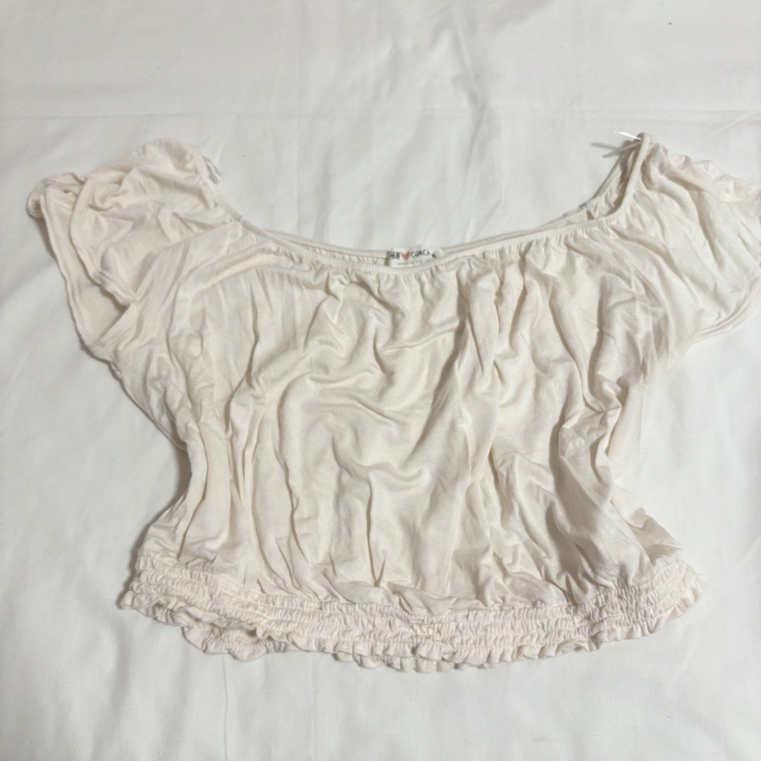 H&M Off-Shoulder Smocked Crop Top (Size: Large) (Category: Shirts) located in Manila. Submitted by shop.by.emi.cutie (Listing ID 1452040358, Image 1). Description: Brand: H&M Color: Cream / Off-White Size: Large (EUR L / US L) Style: Off-shoulder milkmaid / boho crop top Details: Elasticized neckline and short cap sleeves Ruched / gathered front detail Smocked elastic hem Soft and stretchable knit fabric Great for: Summer, casual wear, beach wear