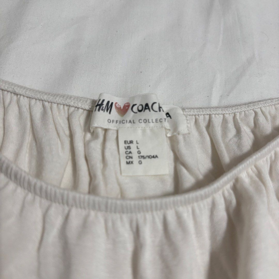 H&M Off-Shoulder Smocked Crop Top (Size: Large) (Category: Shirts) located in Manila. Submitted by shop.by.emi.cutie (Listing ID 1452040358, Image 3). Description: Brand: H&M Color: Cream / Off-White Size: Large (EUR L / US L) Style: Off-shoulder milkmaid / boho crop top Details: Elasticized neckline and short cap sleeves Ruched / gathered front detail Smocked elastic hem Soft and stretchable knit fabric Great for: Summer, casual wear, beach wear