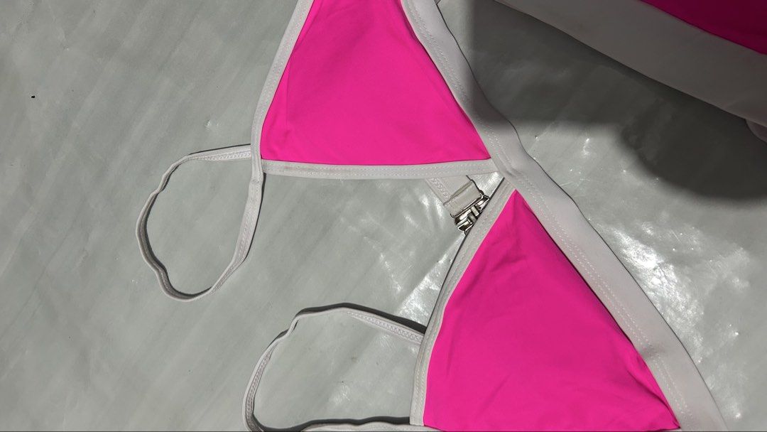 Hot Pink Triangle Bikini with White Trim (Category: Bikinis & Swimsuits) located in Marikina City. Submitted by chartan15 (Listing ID 1452016866, Image 3). Description: Never been used, decluttering Hot pink bikini set! Triangle top, adjustable straps. White waistband bottoms. Perfect for vacation!.