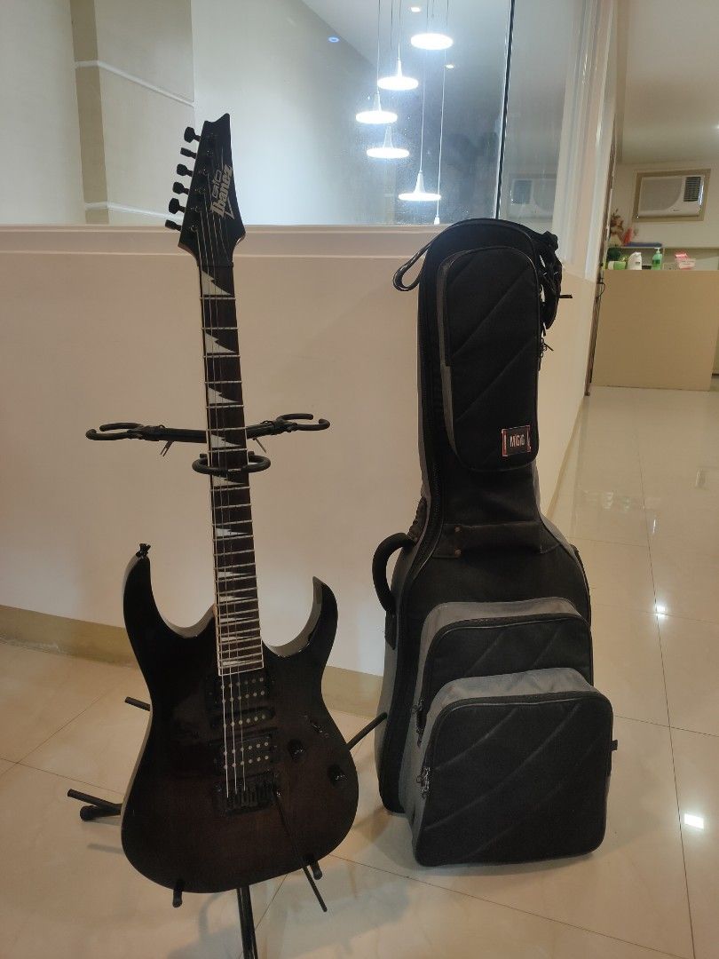 Ibanez GIO Electric Guitar (Category: Musical Instruments) located in Manila. Submitted by shop.zane (Listing ID 1451923658, Image 1). Description: Ibanez GIO Electric Guitar (Black Burst) + Padded Gig Bag Selling Ibanez GIO electric guitar in very good condition. Perfect for beginners, intermediate players, or anyone looking for a reliable guitar for practice, gigs, or recording. Features: HSH pickup configuration (Humbucker-Single-Humbucker) Tr