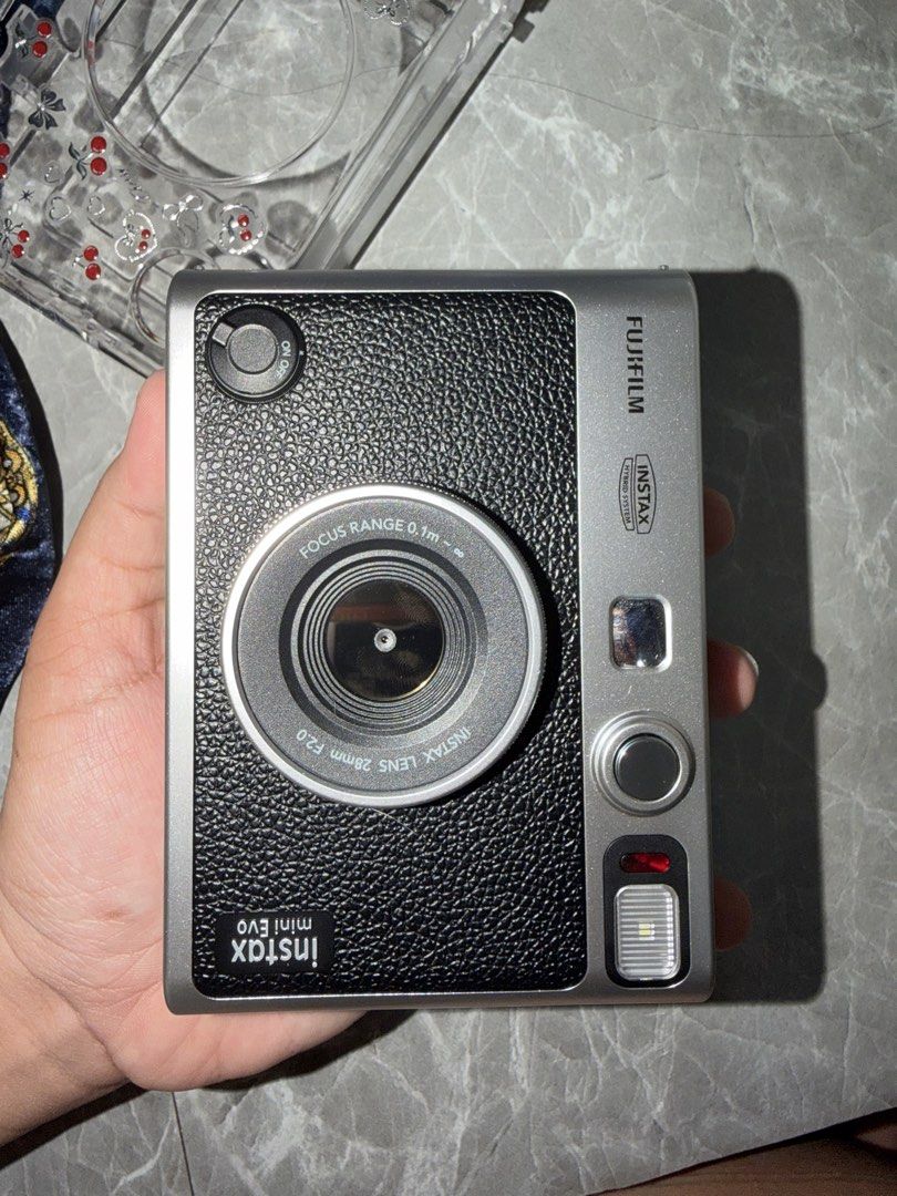 INSTAX MINI EVO (Category: Camera Bags & Carriers) located in Manila. Submitted by percivalarch (Listing ID 1451928822, Image 3). Description: Lightly used, I just need cash thats why I need to sell my beloved camera I have fee freebies like cover of the camera storage Also it has sd card and charger wire.