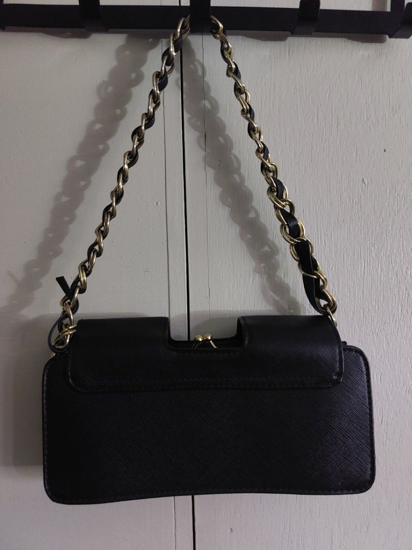 Isaac Mizrahi for Target Black Shoulder Bag (Category: Clutches) located in Baguio. Submitted by corteezol (Listing ID 1452004263, Image 3). Description: - As good as new - Authentic - Secure snap closure - 3 interior compartments - Convenient zippered pocket - Brand: Isaac Mizrahi for Target (inside tag).