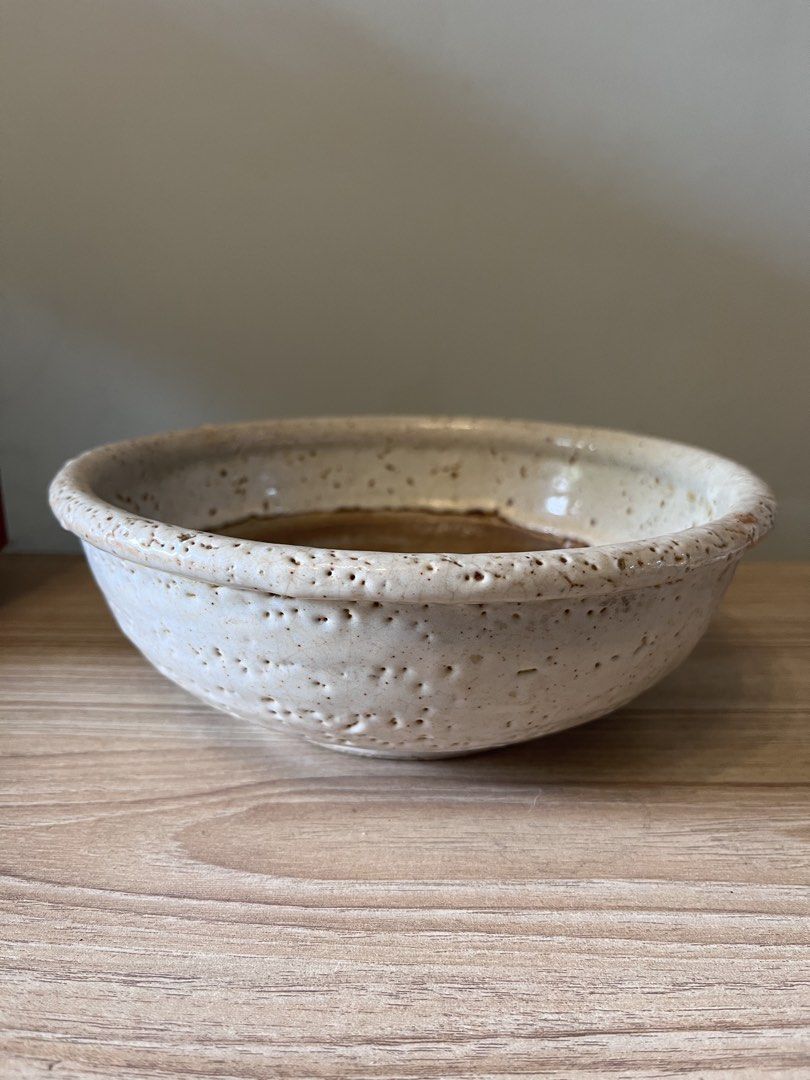 Japanese handcrafted studio ceramic serving bowl / shallow dish (Category: Other Kitchenware & Tableware) located in Quezon City. Submitted by metamerchant (Listing ID 1451914382, Image 2). Description: Glaze & Finish: Features a thick, textured, and pitted white crawling/crackle glaze (yuzuhada or citron skin effect) around the exterior rim and sides, showing iron specks. Interior Detail: The inner base exposes the bare, wheel-thrown brown stone
