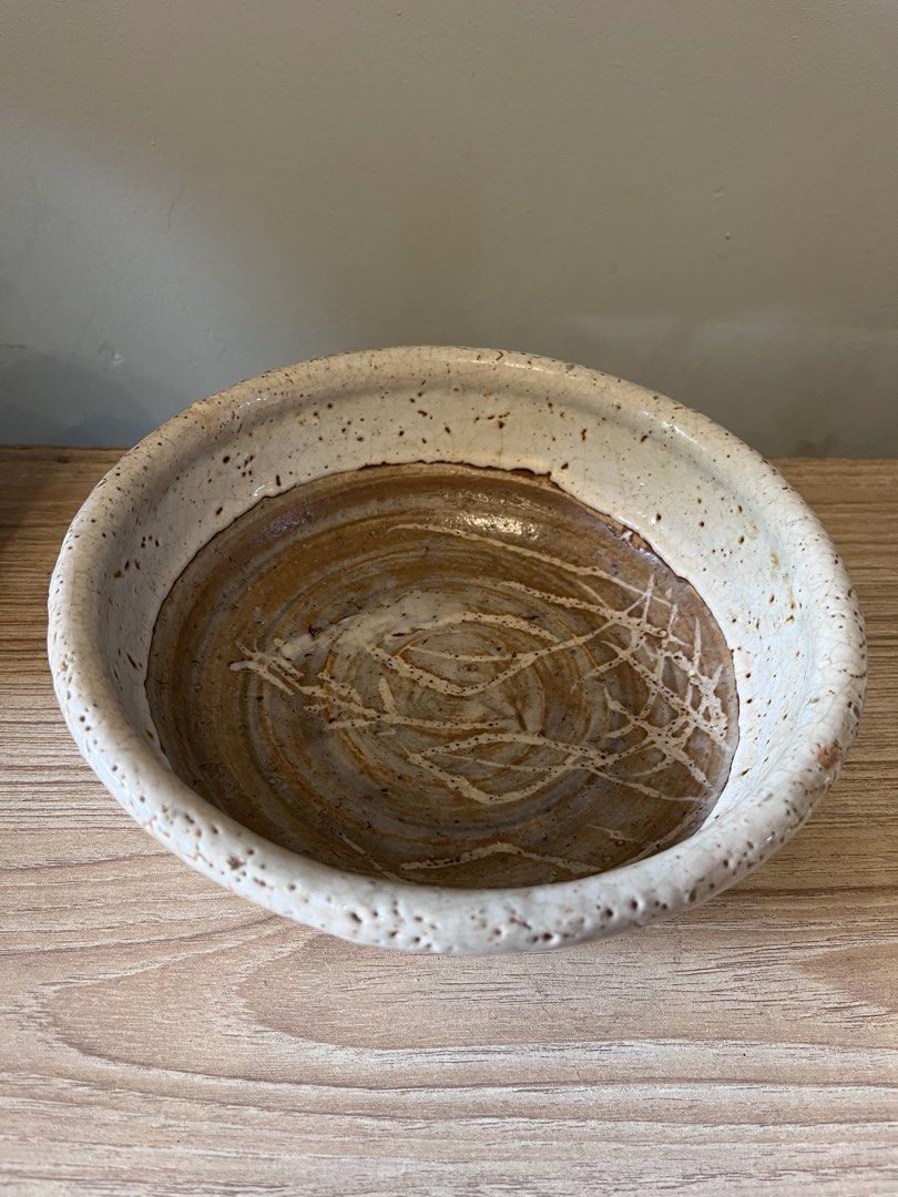Japanese handcrafted studio ceramic serving bowl / shallow dish (Category: Other Kitchenware & Tableware) located in Quezon City. Submitted by metamerchant (Listing ID 1451914382, Image 3). Description: Glaze & Finish: Features a thick, textured, and pitted white crawling/crackle glaze (yuzuhada or citron skin effect) around the exterior rim and sides, showing iron specks. Interior Detail: The inner base exposes the bare, wheel-thrown brown stone