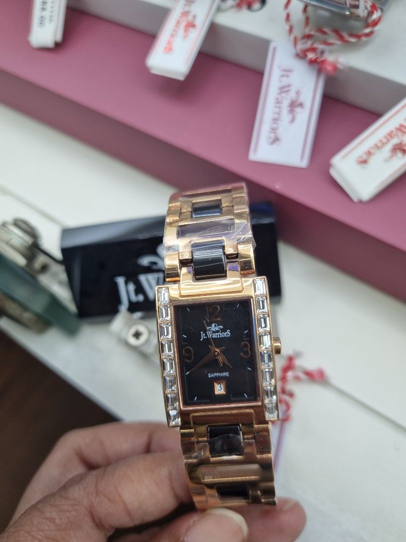 jt.warriors Rose Gold Rectangle Watch with Crystal Accents (Category: Watches) located in Kuala Lumpur. Submitted by swifttiger_0ba6f6 (Listing ID 1452009787, Image 3). Description: - Rectangular watch with a sleek black face - Rose gold band with stylish black and white accents - Dazzling crystal details on the bezel - Durable and scratch-resistant sapphire glass - Convenient date display at the 3 o'clock position - Comes with original tags for 