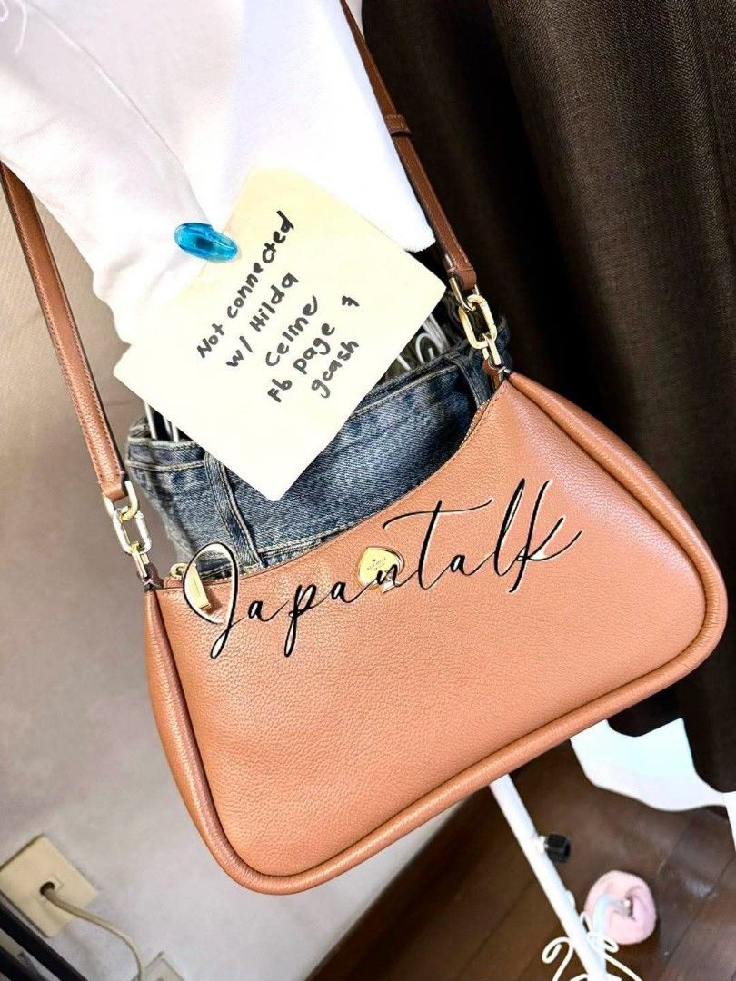 Kate Spade Brown Leather Shoulder Bag (Category: Luxury Bags & Wallets) located in Bulacan. Submitted by vintage_purge (Listing ID 1451914211, Image 2). Description: - Authentic Kate Spade brown leather shoulder bag - Features elegant gold hardware details - Secure zipper closure - Adjustable strap for comfortable wear - Ideal for everyday use.