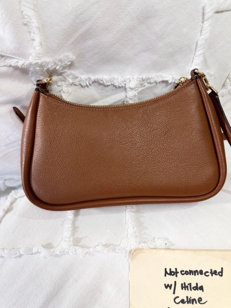 Kate Spade Brown Leather Shoulder Bag (Category: Luxury Bags & Wallets) located in Bulacan. Submitted by vintage_purge (Listing ID 1451914211, Image 3). Description: - Authentic Kate Spade brown leather shoulder bag - Features elegant gold hardware details - Secure zipper closure - Adjustable strap for comfortable wear - Ideal for everyday use.