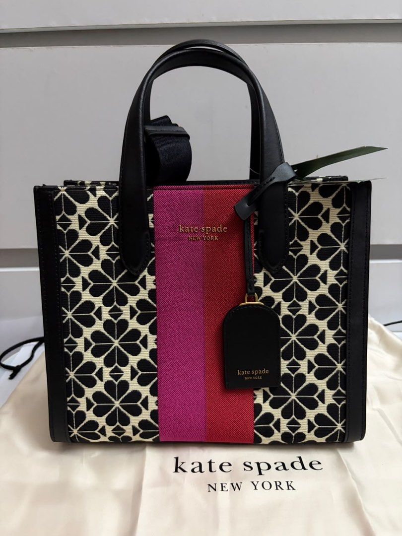 Kate Spade New York (Category: Tote Bags) located in Kuala Lumpur. Submitted by dnialhzmin (Listing ID 1452104738, Image 1). Description: - Brand: Kate Spade - Model: Spade Flower Jacquard Tote Bag - Color: Cream Multi - Design: Classic spade flower pattern with a central pink and red stripe detail - Includes: Original dust bag - Ideal for: Everyday use, weekend getaways, or as a stylish travel companion - Negotiable .