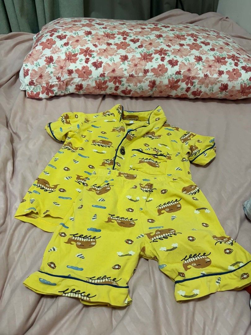 Kids Yellow Whale Print Pajama Set (Category: Babies & Kids Fashion) located in Manila. Submitted by leontheexplorer (Listing ID 1452047757, Image 2). Description: - Adorable yellow pajama set for kids - Features a playful whale and cloud print - Short-sleeved top and matching shorts - Made from comfortable cotton material - Stylish blue trim on collar, sleeves, and shorts hem - Button-up top with a convenient chest pocket - Perfect for a cozy an