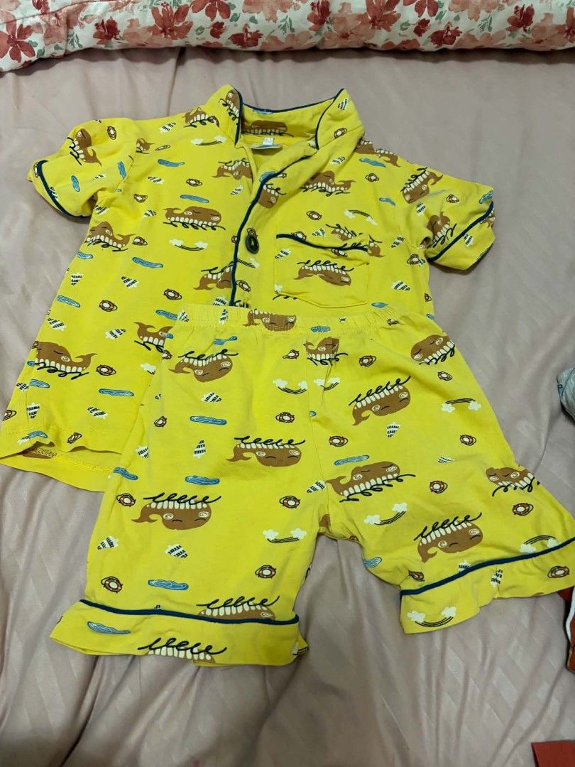 Kids Yellow Whale Print Pajama Set (Category: Babies & Kids Fashion) located in Manila. Submitted by leontheexplorer (Listing ID 1452047757, Image 1). Description: - Adorable yellow pajama set for kids - Features a playful whale and cloud print - Short-sleeved top and matching shorts - Made from comfortable cotton material - Stylish blue trim on collar, sleeves, and shorts hem - Button-up top with a convenient chest pocket - Perfect for a cozy an