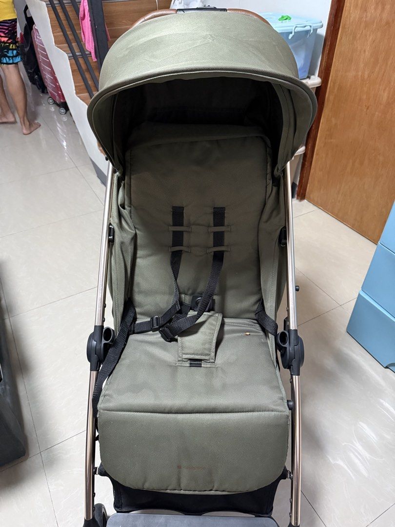 Kikkaboo Autofolding Stroller (Category: Strollers) located in Bacoor. Submitted by jahjha (Listing ID 1452009311, Image 3). Description: - Autofolding Stroller - Lightweight stroller in stylish olive green - Comfortable seat with secure 5-point harness - Canopy offers excellent sun protection - Easy-to-maneuver with a chic brown handlebar - Ideal for everyday outings and travel Freebie: Raincover Price Negiotiable basta magkasundo sa price.