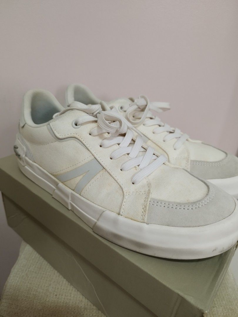 Lacoste CMA White (Category: Casual Shoes) located in Makati City. Submitted by krishtyle (Listing ID 1451967832, Image 2). Description: Selling authentic white Lacoste sneakers (CMA style) as-is. Details: • Size: 9.5 US/8.5UK/42.5EU • Condition: 7/10. The canvas parts show slight yellowing due to storage/oxidation (see photos). No major rips, tears, or deep scratches. • Inclusion: Comes with original box Price: ₱3,000 (nego) RFS : Decluttering m