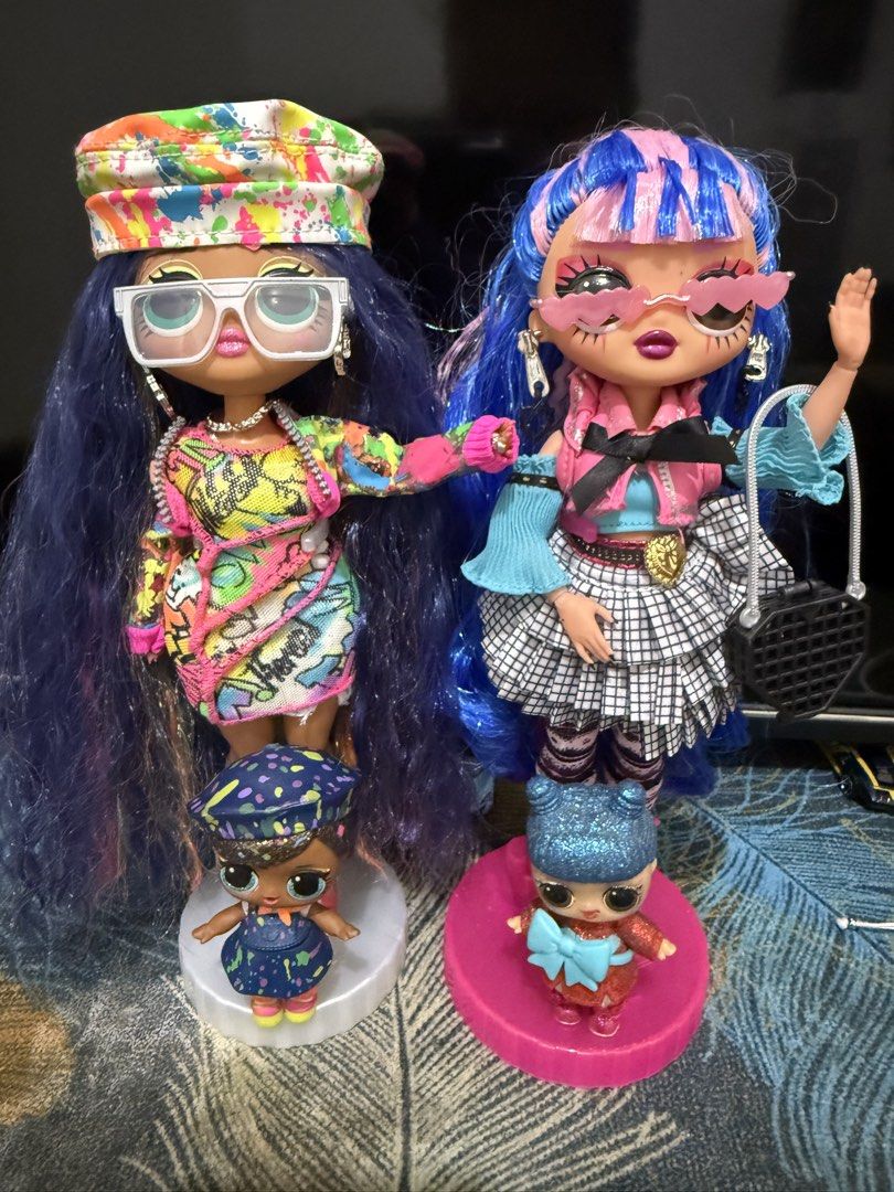 LOL Surprise OMG Dolls with Mini Dolls (Category: Kids Toys) located in Manila. Submitted by krissiena (Listing ID 1452064227, Image 1). Description: - Includes two LOL Surprise OMG fashion dolls. - Each OMG doll comes with a corresponding mini LOL Surprise doll. - All dolls feature unique fashion outfits and accessories. - Great for collectors and imaginative play. - All dolls pictured are included in the set. With box complete accessories.
