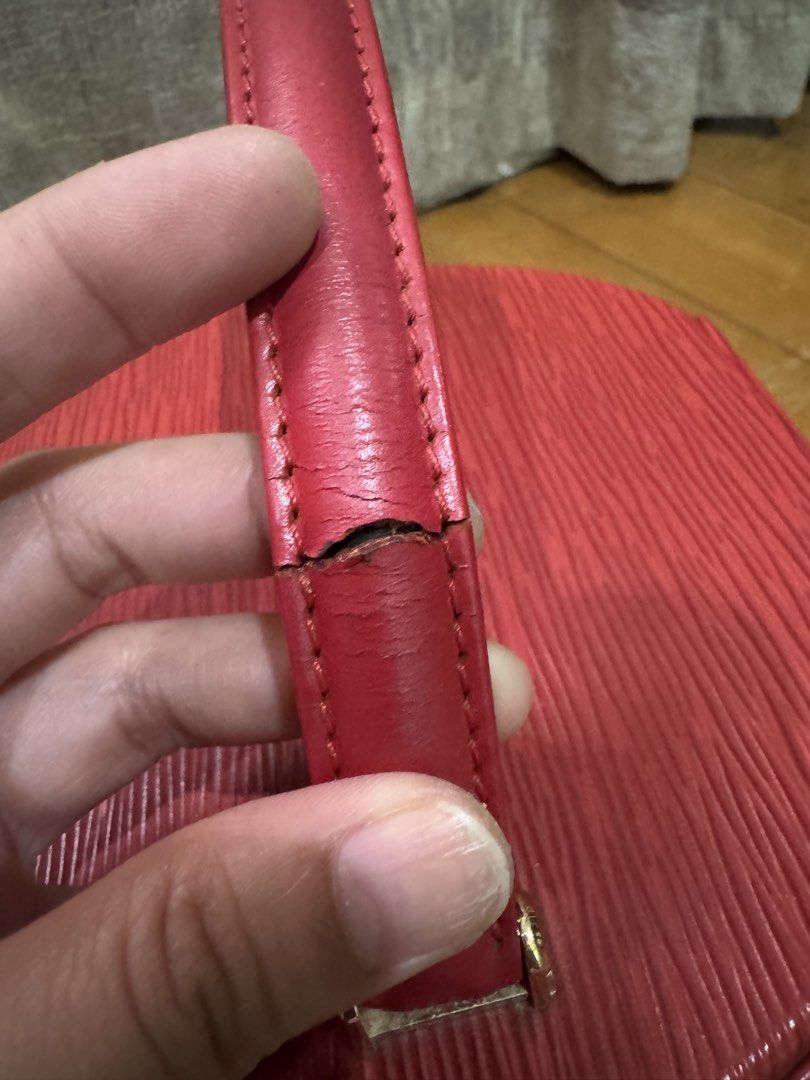 Louis Vuitton Epi Leather Vanity Case (Category: Luxury Bags & Wallets) located in Las Pinas. Submitted by katfg (Listing ID 1451942351, Image 3). Description: - Vintage Louis Vuitton vanity case - Red Epi leather - Cylindrical shape - Zip-around closure - Handle shows cracking - Small tear on leather zipper pull - Minor signs of wear on leather - Classic collectible piece.