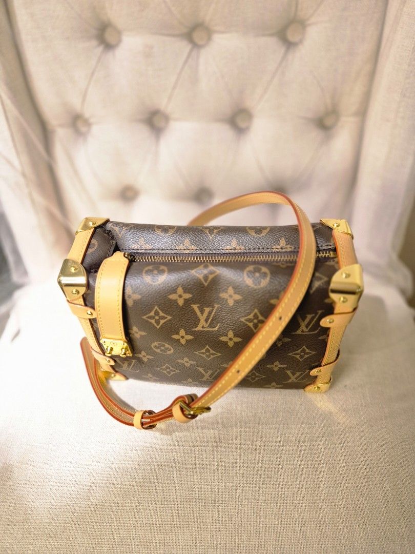 Louis Vuitton Monogram Sling Bag (Category: Luxury Bags & Wallets) located in Makati City. Submitted by femosseverything (Listing ID 1452092979, Image 2). Description: - Classic Louis Vuitton monogram trunk bag - Iconic LV print - Gold hardware details - Leather trim and strap - Zipper closure - Stylish for day or night usual signs of use, but still looks like new need funds.