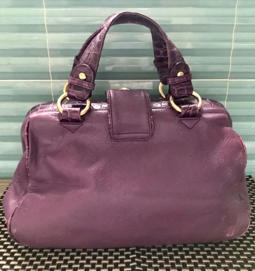 Lovcat Purple Croc Embossed Leather Handbag (Category: Luxury Bags & Wallets) located in Caloocan City. Submitted by silentfire.30c1e3 (Listing ID 1451988983, Image 2). Description: - Stylish purple handbag with luxurious heart-embossed texture. - Elegant gold-tone hardware. - Secure double metal overlapping closure. - Convenient interior zip pocket. - Fun patterned lining. - Versatile for everyday wear or evening events..