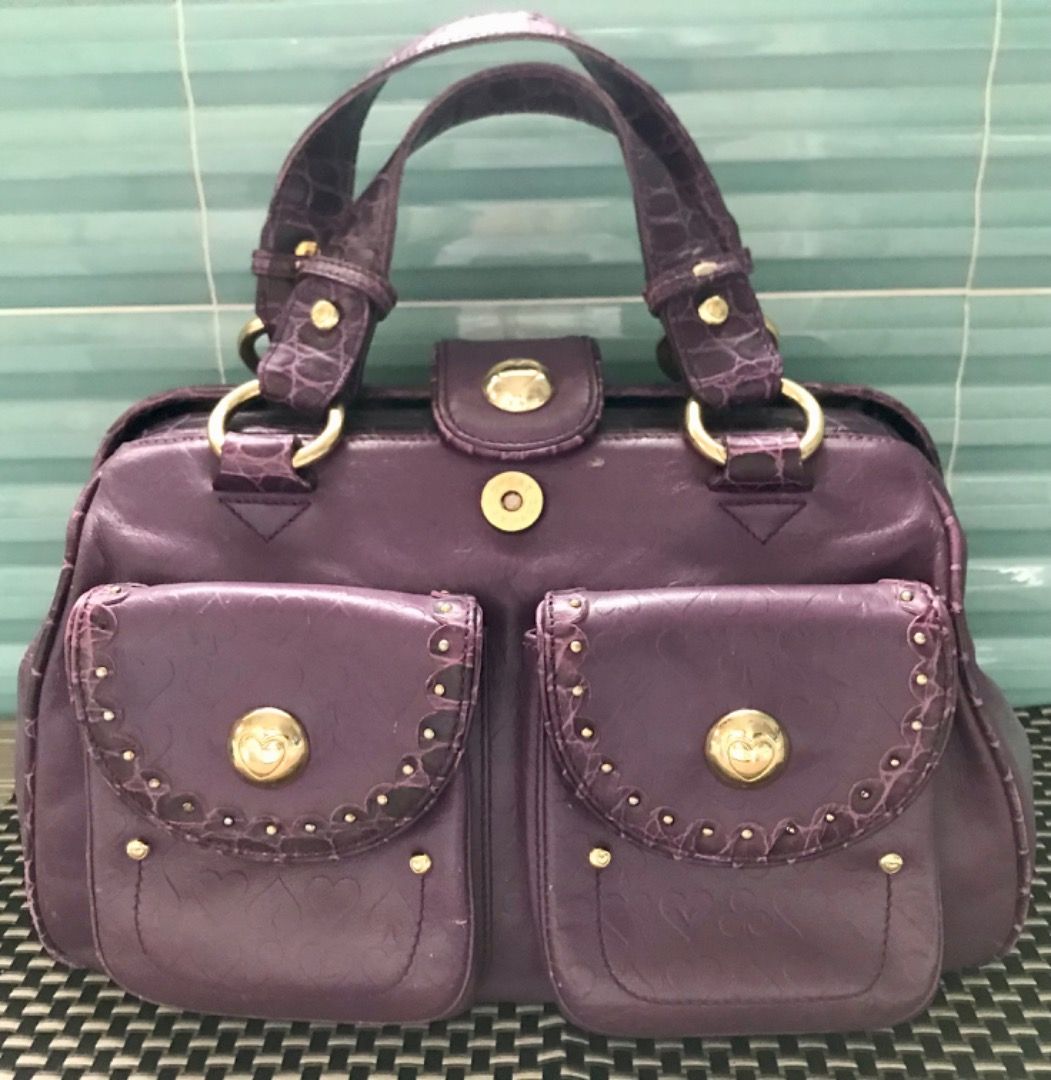 Lovcat Purple Croc Embossed Leather Handbag (Category: Luxury Bags & Wallets) located in Caloocan City. Submitted by silentfire.30c1e3 (Listing ID 1451988983, Image 1). Description: - Stylish purple handbag with luxurious heart-embossed texture. - Elegant gold-tone hardware. - Secure double metal overlapping closure. - Convenient interior zip pocket. - Fun patterned lining. - Versatile for everyday wear or evening events..