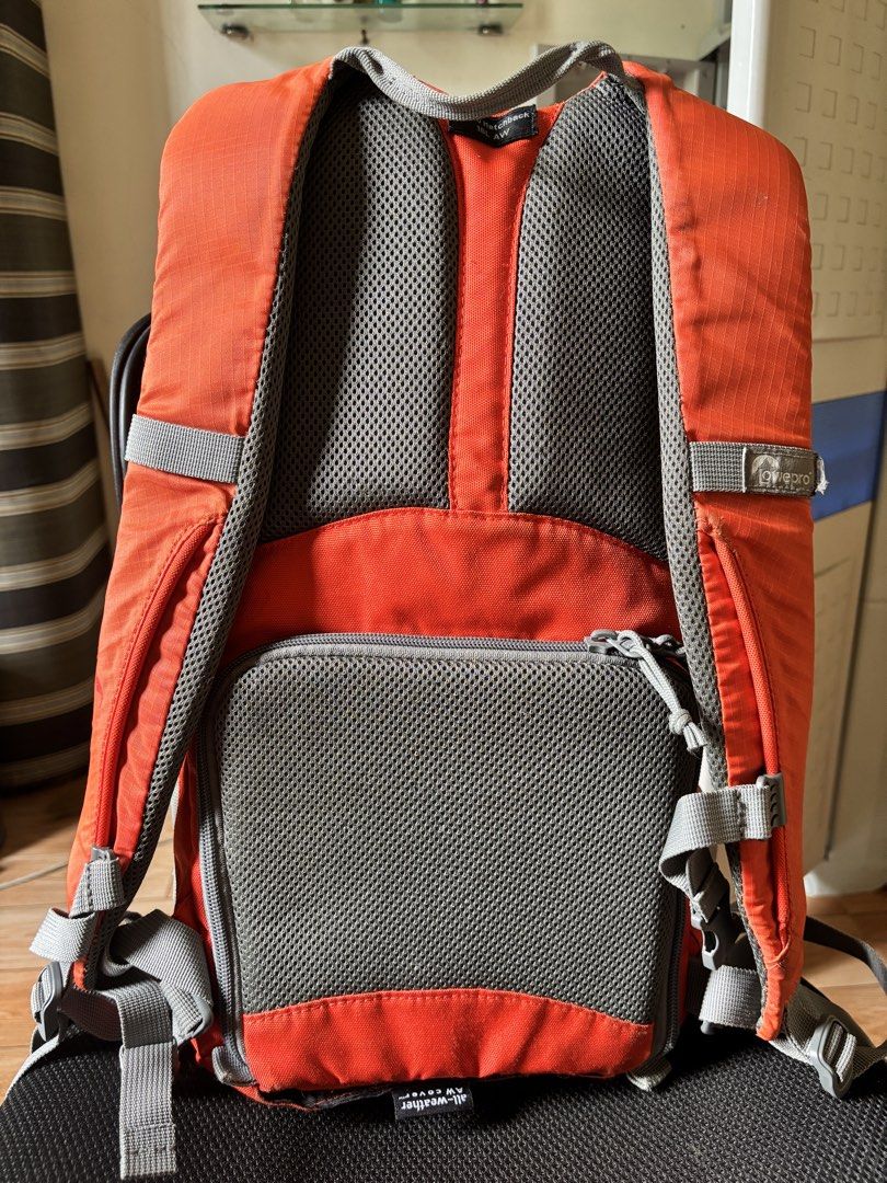 Lowepro Orange Camera Backpack (Category: Backpacks) located in Caloocan City. Submitted by juanmig_bundok (Listing ID 1451949106, Image 2). Description: - Orange Lowepro backpack, perfect for photographers on the go. - Features padded compartments inside to safely store camera gear. - Convenient top opening with an additional zippered pocket. - Includes a front zippered pocket for quick access items. - Side mesh pocket for water bottles or acces