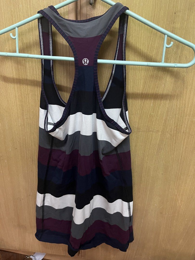Lululemon Activewear Striped Racerback Tank Top (Category: Activewear) located in Manila. Submitted by cccuyyy (Listing ID 1451952590, Image 2). Description: - Lululemon racerback tank top - Features horizontal stripes in white, grey, black, navy, and burgundy - Versatile for workouts or casual wear - Made with comfortable and breathable material - Pre-loved item with some signs of wear, but plenty of life left.