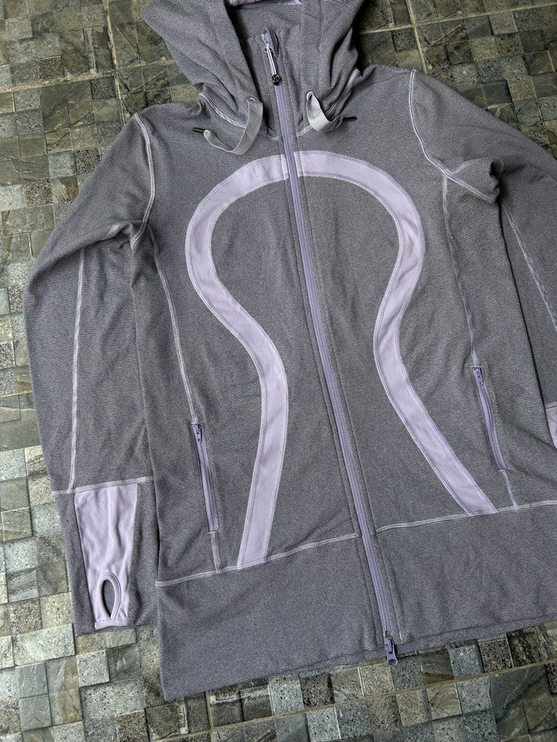 Lululemon Stride Jacket (Category: Coats, Jackets and Outerwear) located in Quezon City. Submitted by commonwealthpickerph (Listing ID 1451982136, Image 3). Description: Lululemon Stride Jacket hoodie with lavender accents - 19.5 width // 28 length - Full zip closure - Thumbholes on sleeves - Two zippered front pockets - Comfortable and stylish for workouts or casual wear - Great for layering - In excellent condition - No major issues - Has minor