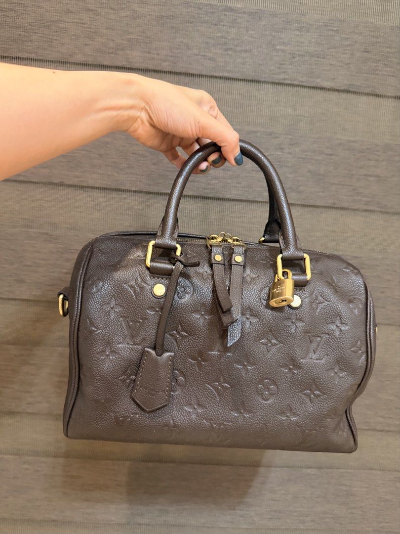 LV Speedy 25 Empreinte Brown Bando (Lost Strap) (Category: Luxury Bags & Wallets) located in Manila. Submitted by sweetluxuryph (Listing ID 1451895561, Image 2). Description: - Authentic Louis Vuitton Speedy 25 - Empreinte Leather in Brown - Comes with: Clochette, Lock, Keys, Dustbag, Box - Original Retail Price: PHP 179,000 - Selling Price: PHP 48,000 - **Note:** Strap is lost.