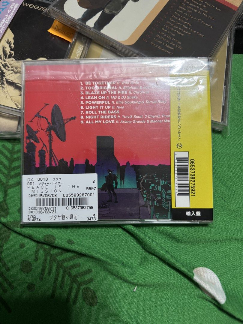 Major Lazer Peace Is The Mission CD (Category: CDs & DVDs) located in Pasig City. Submitted by proteinboy6 (Listing ID 1451976294, Image 2). Description: - Major Lazer's 'Peace Is The Mission' CD - Featuring hit tracks: 'Lean On' and 'Powerful' - Collaborations with Ellie Goulding, Travis Scott, and Ariana Grande - Japanese pressing with original obi strip - Essential album for electronic music fans.