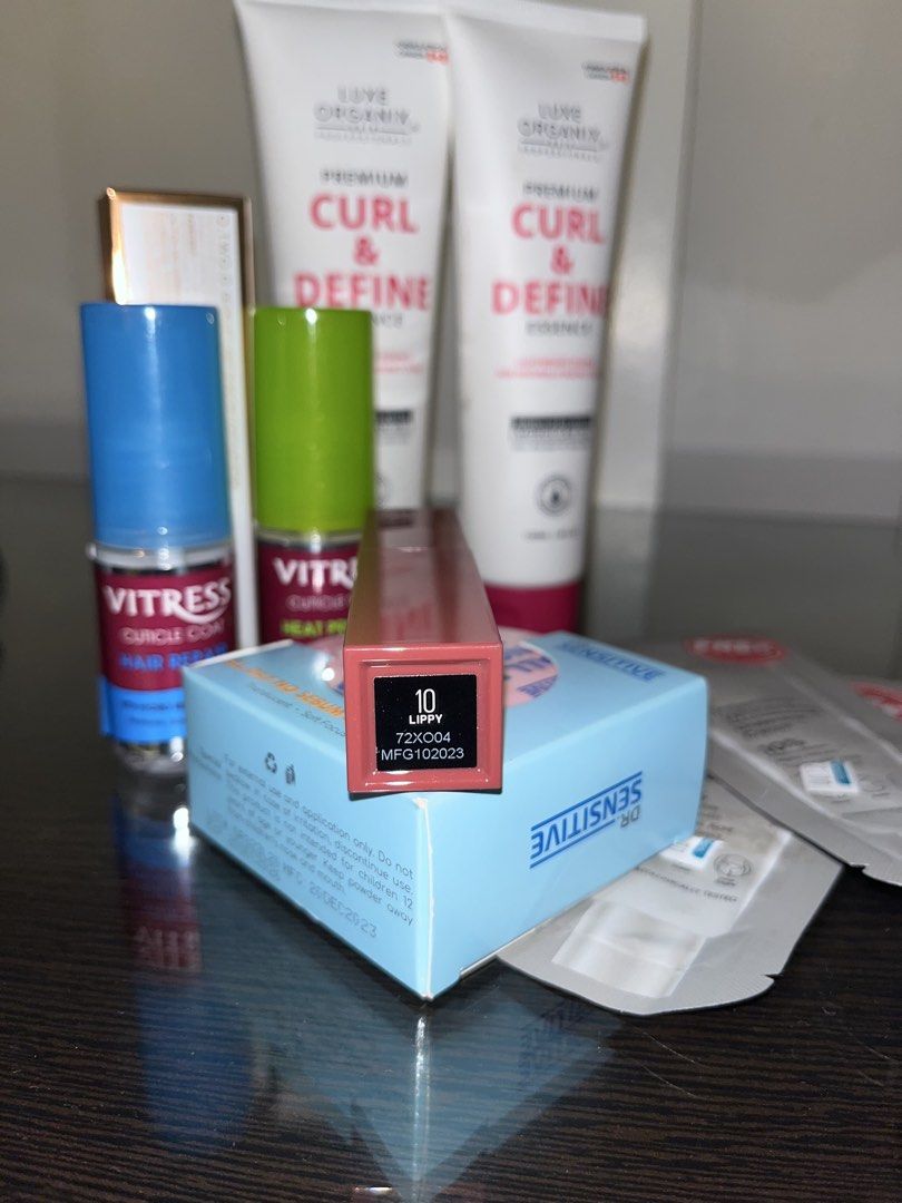 Makeup Bundle (Category: Makeup) located in Quezon City. Submitted by mynameisdanille (Listing ID 1452089909, Image 3). Description: Makeup Bundle 1 - Dr. Sensitive All Day No Sebum Blur Powder Translucent (Brand New) - Maybelline Superstay Vinyl Ink (Shade: 10 Lippy) (99% Full) - O.two.O Contour and Highlighter Stick Duo [Shade 02] (99% Full) - 2pcs Luxe Organix Curl and Define Essence (Brand New) - 2pcs Vitress Hair Repair and Vitress Hair Prot