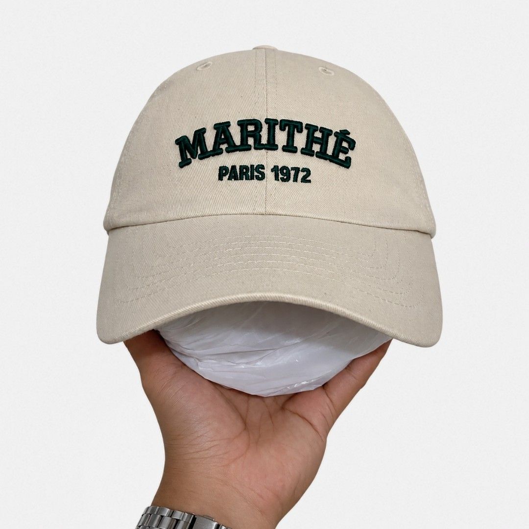 Marithe Francois Girbaud College Cap - Beige (Category: Caps & Hats) located in Bacolod City. Submitted by bt_ph (Listing ID 1451902491, Image 2). Description: - One size fits most - Strap back - Classic beige cap from Marithe Francois Girbaud - Features embroidered 'MARITHE PARIS 1972' on the front .