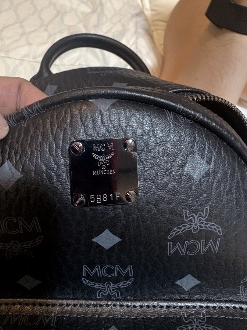 MCM Monogram Mini Backpack Black (Category: Backpacks) located in Mandaluyong City. Submitted by olxph_821033014 (Listing ID 1451952436, Image 3). Description: - Authentic MCM mini backpack - Classic black with all-over MCM monogram print - Genuine leather trim and straps - Main compartment with leather internal organization pockets - Includes a matching small MCM wallet add additional 1k - Dust bag for protection and storage - no issues like new