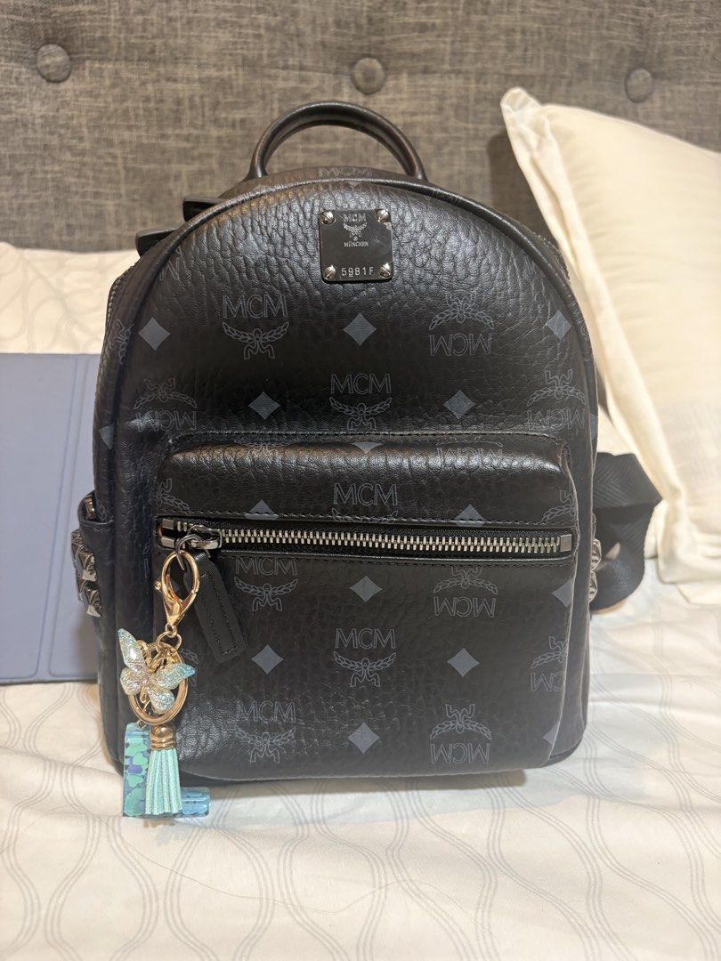 MCM Monogram Mini Backpack Black (Category: Backpacks) located in Mandaluyong City. Submitted by olxph_821033014 (Listing ID 1451952436, Image 1). Description: - Authentic MCM mini backpack - Classic black with all-over MCM monogram print - Genuine leather trim and straps - Main compartment with leather internal organization pockets - Includes a matching small MCM wallet add additional 1k - Dust bag for protection and storage - no issues like new