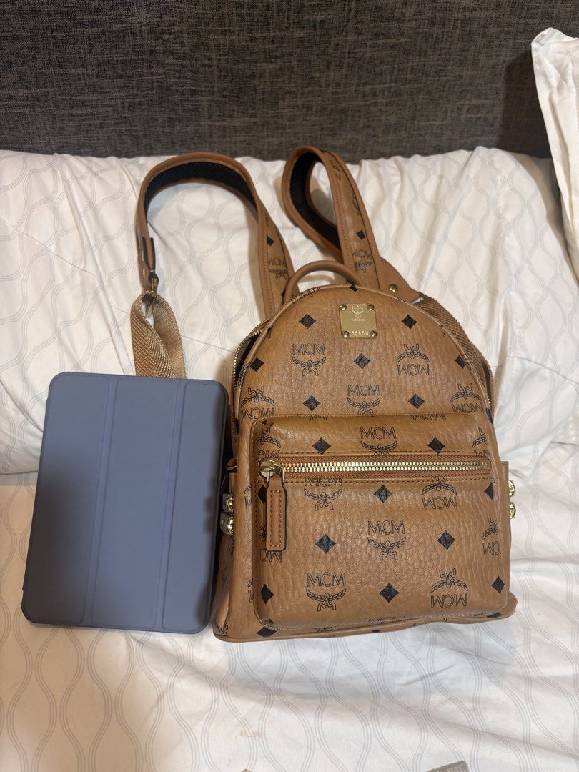 MCM Visetos Mini Backpack Cognac (Category: Backpacks) located in Mandaluyong City. Submitted by olxph_821033014 (Listing ID 1451950511, Image 1). Description: - Classic MCM mini backpack - Iconic Visetos print - Color: Cognac - Hardware: Gold - Zippers: Smoothly working YKK zipper - Interior: Small pocket and leather inside - coded with QR code.