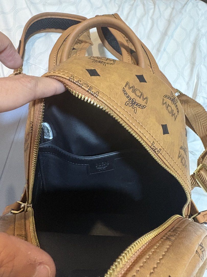 MCM Visetos Mini Backpack Cognac (Category: Backpacks) located in Mandaluyong City. Submitted by olxph_821033014 (Listing ID 1451950511, Image 2). Description: - Classic MCM mini backpack - Iconic Visetos print - Color: Cognac - Hardware: Gold - Zippers: Smoothly working YKK zipper - Interior: Small pocket and leather inside - coded with QR code.