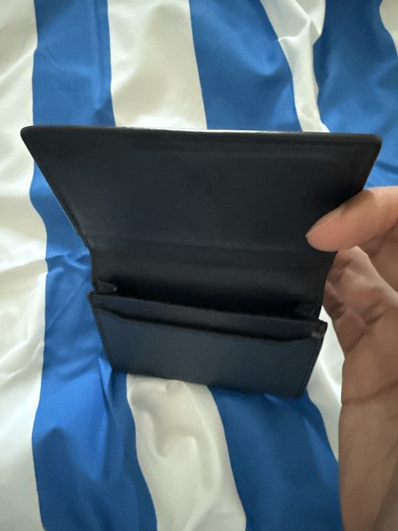 Michael Kors Navy Blue Card Holder (Category: Wallets & Card Holders) located in Kuala Lumpur. Submitted by syahir318 (Listing ID 1451989103, Image 1). Description: - Michael Kors Navy Blue Card Holder - Multiple internal card slots - Clean and simple design - Perfect for organizing your essentials - Easily fits into pockets or small bags .