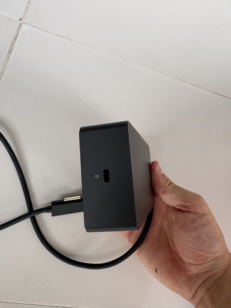Microsoft Surface Docking Station (Category: Cables & Adaptors) located in Singapore. Submitted by maxime.redhill (Listing ID 1451979010, Image 3). Description: - Microsoft Surface Dock - Connects Surface devices to external displays, power, and accessories - Features Ethernet port - Includes USB ports - Supports display outputs - In good working condition - Selling because it's no longer needed.