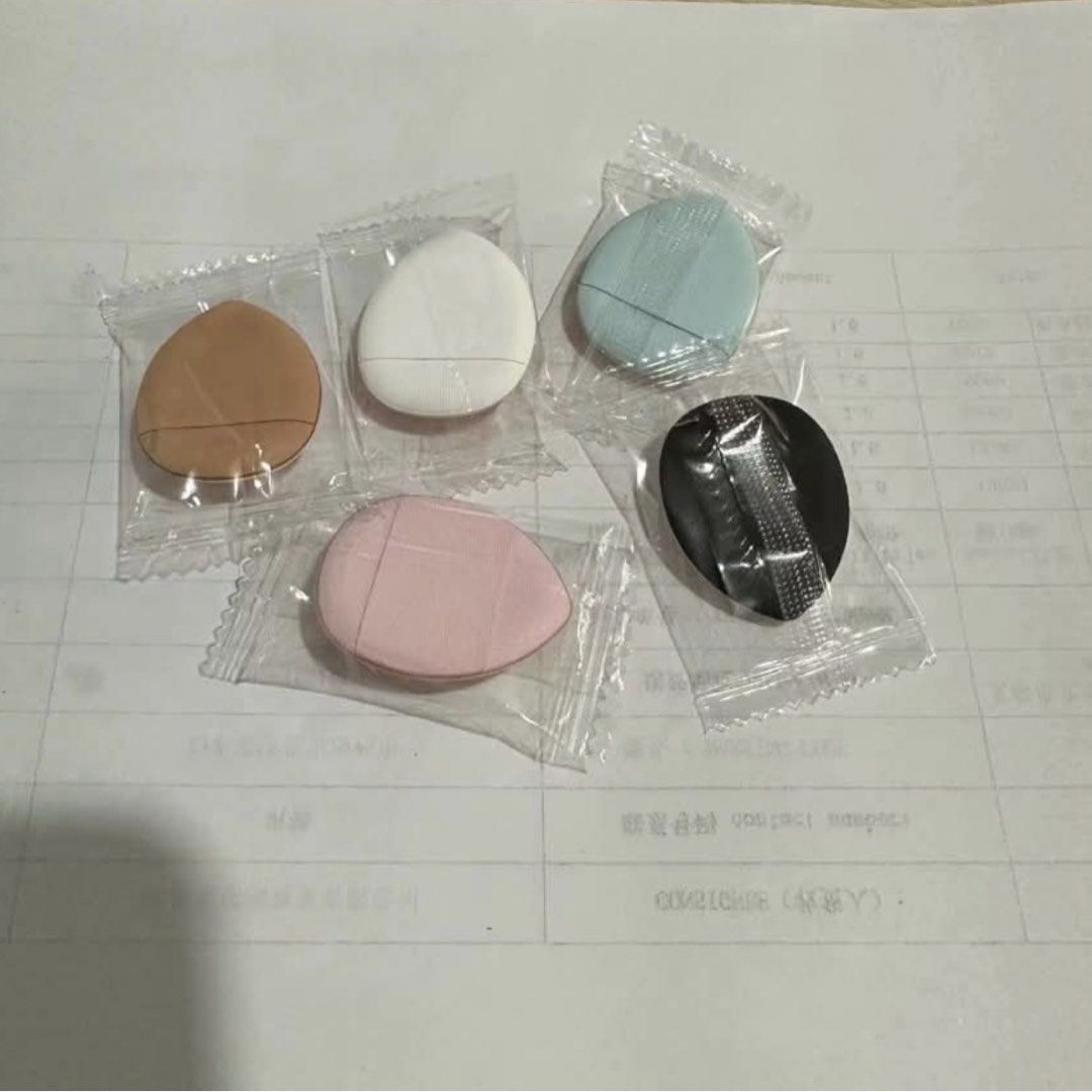 Mini Fingertip Powder Puffs for Flawless Base Makeup (Category: Makeup) located in Quezon City. Submitted by paosells (Listing ID 1451951004, Image 1). Description: - Perfect for precise makeup application. - Pointed tip ideal for nose and eye areas. - Wide base quickly covers blemishes and redness. - Hydrophilic material absorbs minimal powder. - Soft, non-deforming sponge air cushion. - PU leather layer helps keep it clean. - Available in: Whit