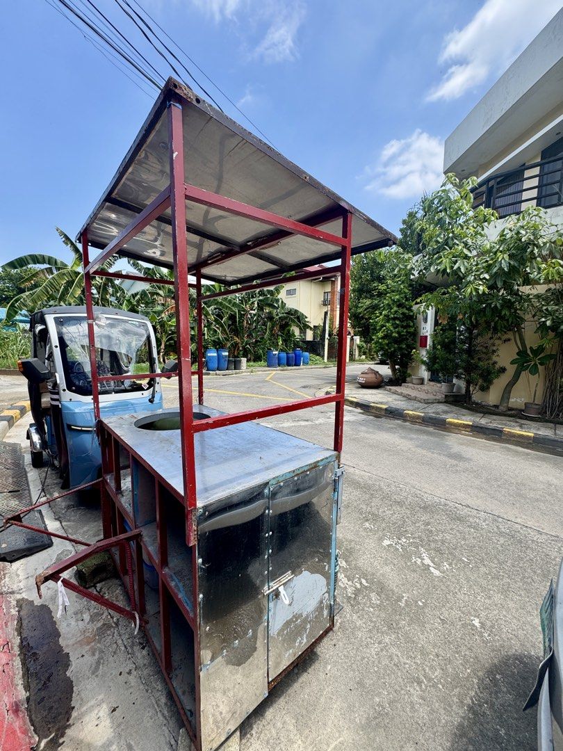 Mobile Food Cart with Canopy and Storage (Category: Food Organization & Storage) located in Cainta. Submitted by danica010314 (Listing ID 1452033591, Image 2). Description: - Sturdy metal frame with sun-protective canopy - Large top opening for easy access - Ample storage compartments below - Equipped with wheels for effortless mobility - Ideal for street food vending or any mobile business venture.