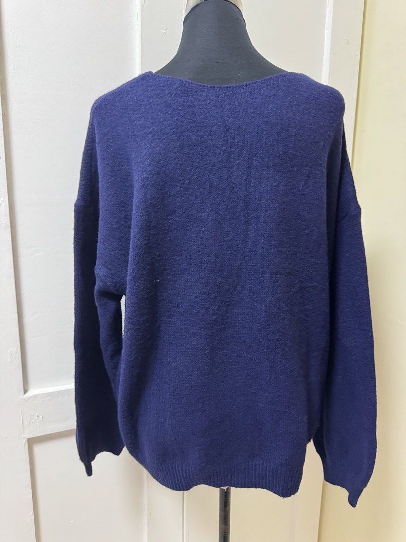 Navy Blue V-Neck ribbon Sweater plus size 2XL (Category: Longsleeves) located in Manila. Submitted by milleshoppppp (Listing ID 1452097268, Image 2). Description: - Navy blue V-neck sweater - Cute ribbon tie detail at the front - Long sleeves - Material: Acrylic and Polyester blend - Size: 2XL - Ideal for casual wear.
