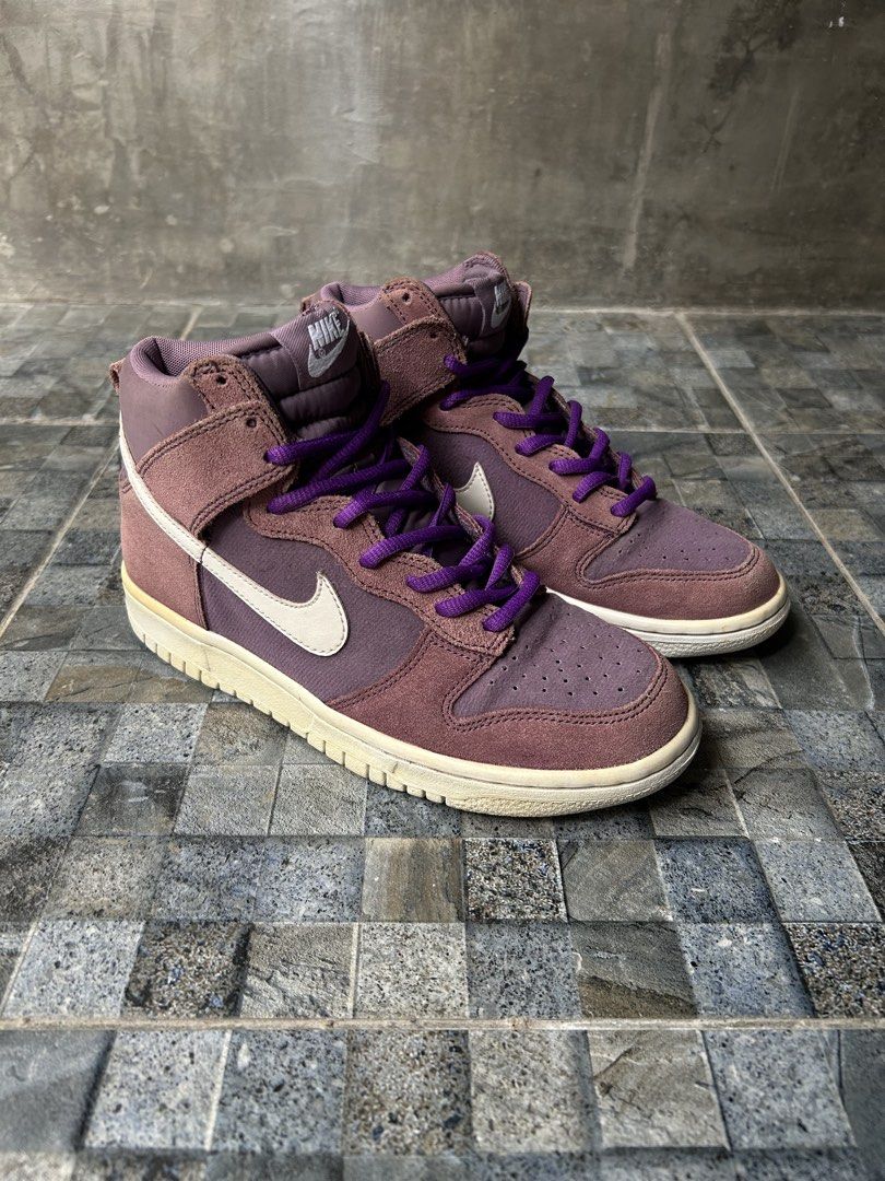 Nike Dunk High Sneakers 6.5 US W (Category: Sneakers) located in Quezon City. Submitted by commonwealthpickerph (Listing ID 1451974827, Image 3). Description: Nike Dunk High Sneakers 6.5 US W - 37.5 Euro // 23.5 CM - Eye-catching purple colorway - Premium suede accents - Vibrant purple laces - Iconic Nike swoosh on the side - Versatile for casual wear or adding flair to your outfit - In good condition - It has sign of used ( some part has yellowi
