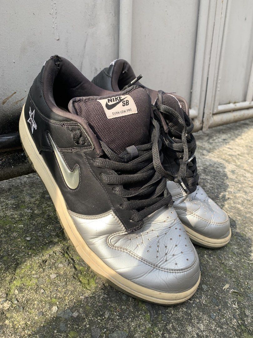 Nike SB Dunk Low Pro Supreme Black Silver (Category: Sneakers) located in Manila. Submitted by aris_bantug_complex (Listing ID 1451955715, Image 1). Description: - Supreme x Nike SB Dunk Low Pro - Colorway: Black and Silver - Iconic Supreme star logo on the side - Laces feature 'Famous World' text - Classic skate shoe design .