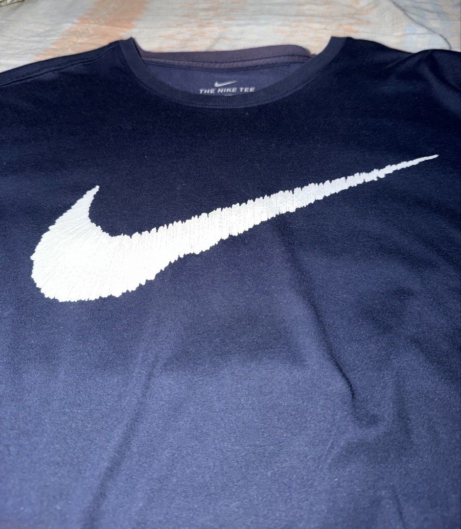 Nike Tee Dri-Fit Navy Blue (Category: Tshirts & Polo Shirts ) located in Manila. Submitted by spectral.ivot (Listing ID 1452063451, Image 2). Description: - Was a gift from the US 2 years ago. Fabric still brand new no holes, swoosh print still looks brand new. Worn it several times. Very minor discoloration on inner collar area (see 4th pic). - Size is Large on tag, but it fits a medium. Exact dimensions: Chest: 20" Length: 27" Payment first bas