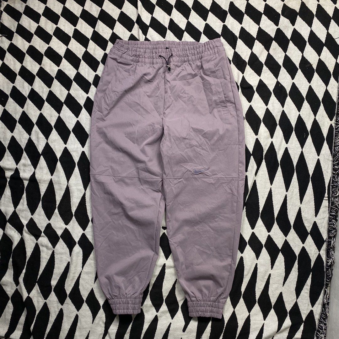 Nike Track Pants Joggers XL Purple (Category: Joggers) located in Cebu City. Submitted by theloose.thread (Listing ID 1452070404, Image 1). Description: - Purple Nike track pants - Size XL - Elastic waistband with drawstring - Cuffed ankles - Two side pockets - Made in Vietnam.