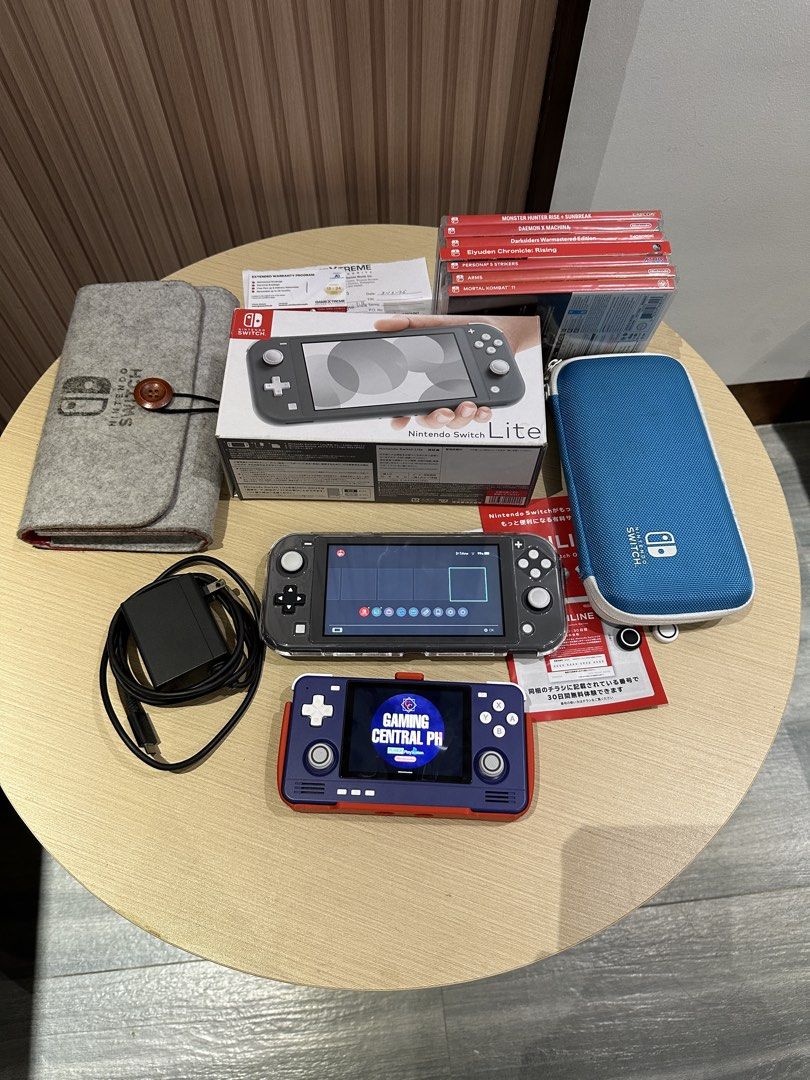 Nintendo Switch Lite Gray with Accessories and Games (Category: Nintendo) located in Bulacan. Submitted by gamingcentralph (Listing ID 1451932039, Image 1). Description: Switch #958 Nintendo Switch Lite with 2 years warranty Inclusions: Nintendo Switch Lite (Grey) Unit Nintendo Switch Lite Box Nintendo Switch Lite charger Nintendo Switch Lite crystal case Nintendo Switch Lite pouch Nintendo Switch Lite hard pouch Nintendo Switch Lite tempered gla