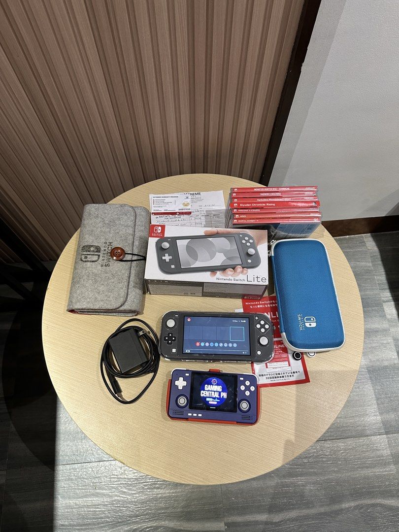 Nintendo Switch Lite Gray with Accessories and Games (Category: Nintendo) located in Bulacan. Submitted by gamingcentralph (Listing ID 1451932039, Image 2). Description: Switch #958 Nintendo Switch Lite with 2 years warranty Inclusions: Nintendo Switch Lite (Grey) Unit Nintendo Switch Lite Box Nintendo Switch Lite charger Nintendo Switch Lite crystal case Nintendo Switch Lite pouch Nintendo Switch Lite hard pouch Nintendo Switch Lite tempered gla