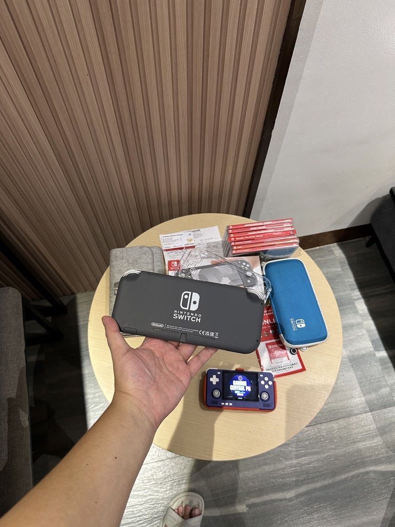Nintendo Switch Lite Gray with Accessories and Games (Category: Nintendo) located in Bulacan. Submitted by gamingcentralph (Listing ID 1451932039, Image 3). Description: Switch #958 Nintendo Switch Lite with 2 years warranty Inclusions: Nintendo Switch Lite (Grey) Unit Nintendo Switch Lite Box Nintendo Switch Lite charger Nintendo Switch Lite crystal case Nintendo Switch Lite pouch Nintendo Switch Lite hard pouch Nintendo Switch Lite tempered gla