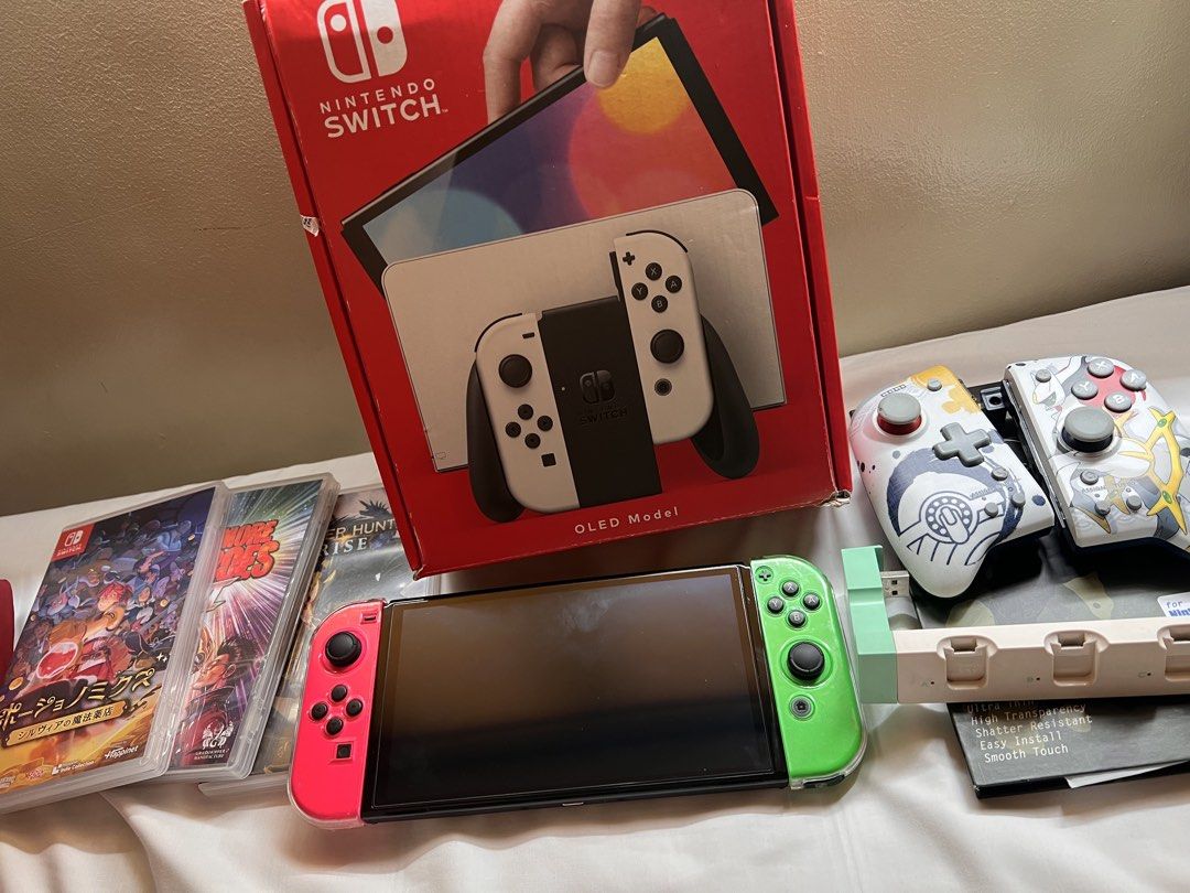 Nintendo Switch OLED Model w/ Pokemon Controllers & Games (Category: Nintendo) located in Manila. Submitted by miyusaionji (Listing ID 1451991679, Image 1). Description: 🎮 FOR SALE: Nintendo Switch OLED Selling my Nintendo Switch OLED 📦 Box Includes: ✅ Joy-Con Wrist Straps ✅ Nintendo Switch Dock ✅ HDMI Cable ✅ AC Adapter ✅ Original Box ❌ Digital Games not included ❌ Original white Joy-Cons are no longer available. ⚠️ Issue: Pink Joy-Con also wo