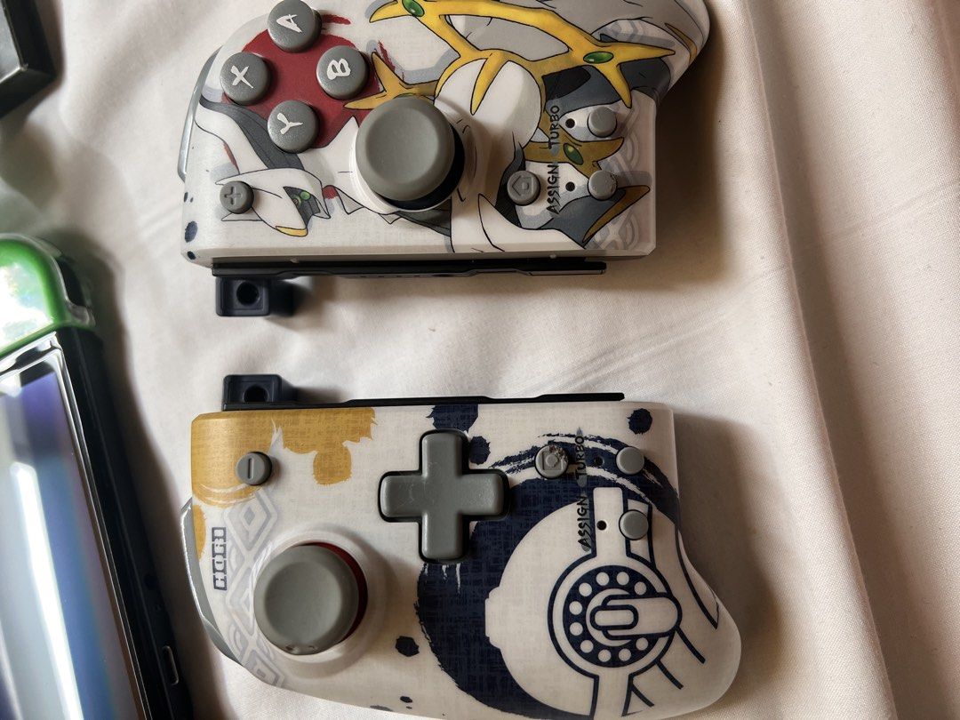 Nintendo Switch OLED Model w/ Pokemon Controllers & Games (Category: Nintendo) located in Manila. Submitted by miyusaionji (Listing ID 1451991679, Image 3). Description: 🎮 FOR SALE: Nintendo Switch OLED Selling my Nintendo Switch OLED 📦 Box Includes: ✅ Joy-Con Wrist Straps ✅ Nintendo Switch Dock ✅ HDMI Cable ✅ AC Adapter ✅ Original Box ❌ Digital Games not included ❌ Original white Joy-Cons are no longer available. ⚠️ Issue: Pink Joy-Con also wo