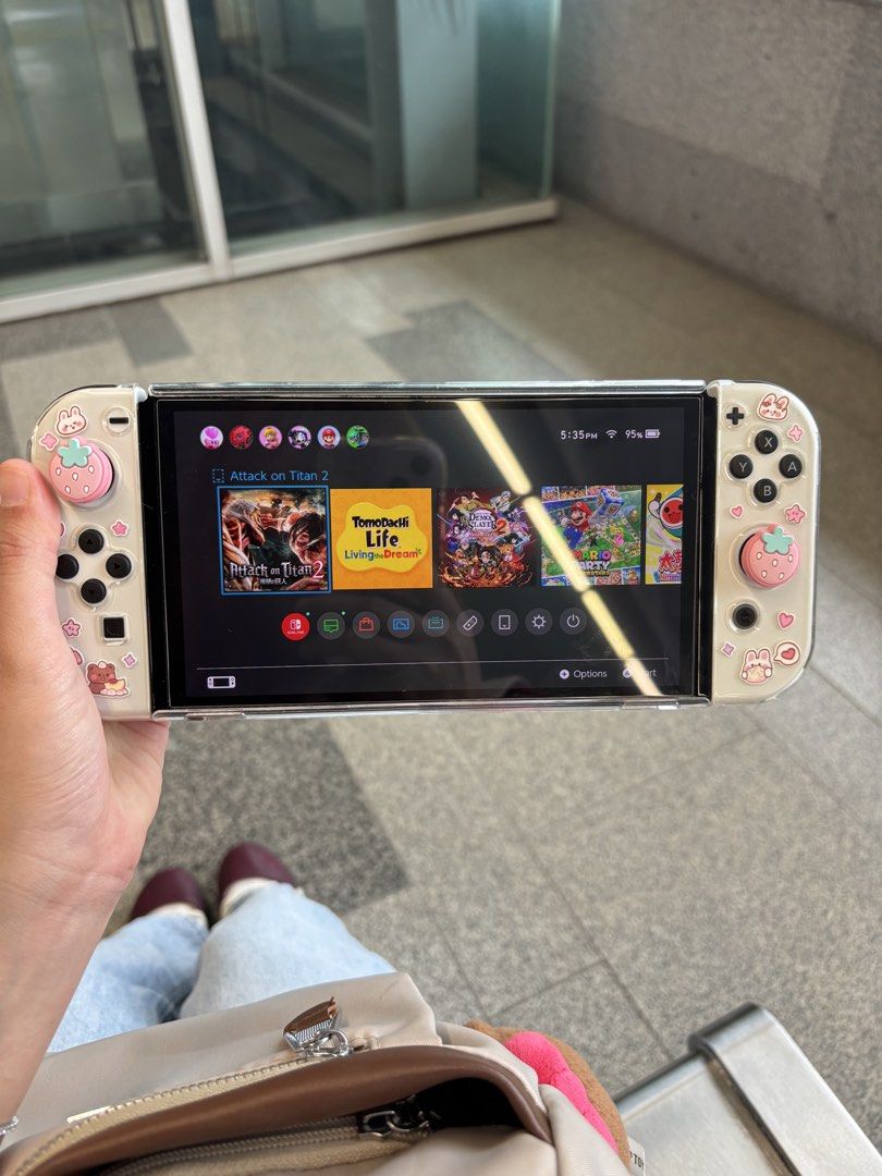 Nintendo Switch OLED White (Category: Nintendo) located in Kuala Lumpur. Submitted by miyuriisan (Listing ID 1452064919, Image 1). Description: Selling my Nintendo Switch OLED (White), purchased a month ago. - Excellent condition, almost like new - No issues, no defects, everything works perfectly - Screen protector already applied neatly - FREE cute protective case - FREE thumbstick grip accessories.